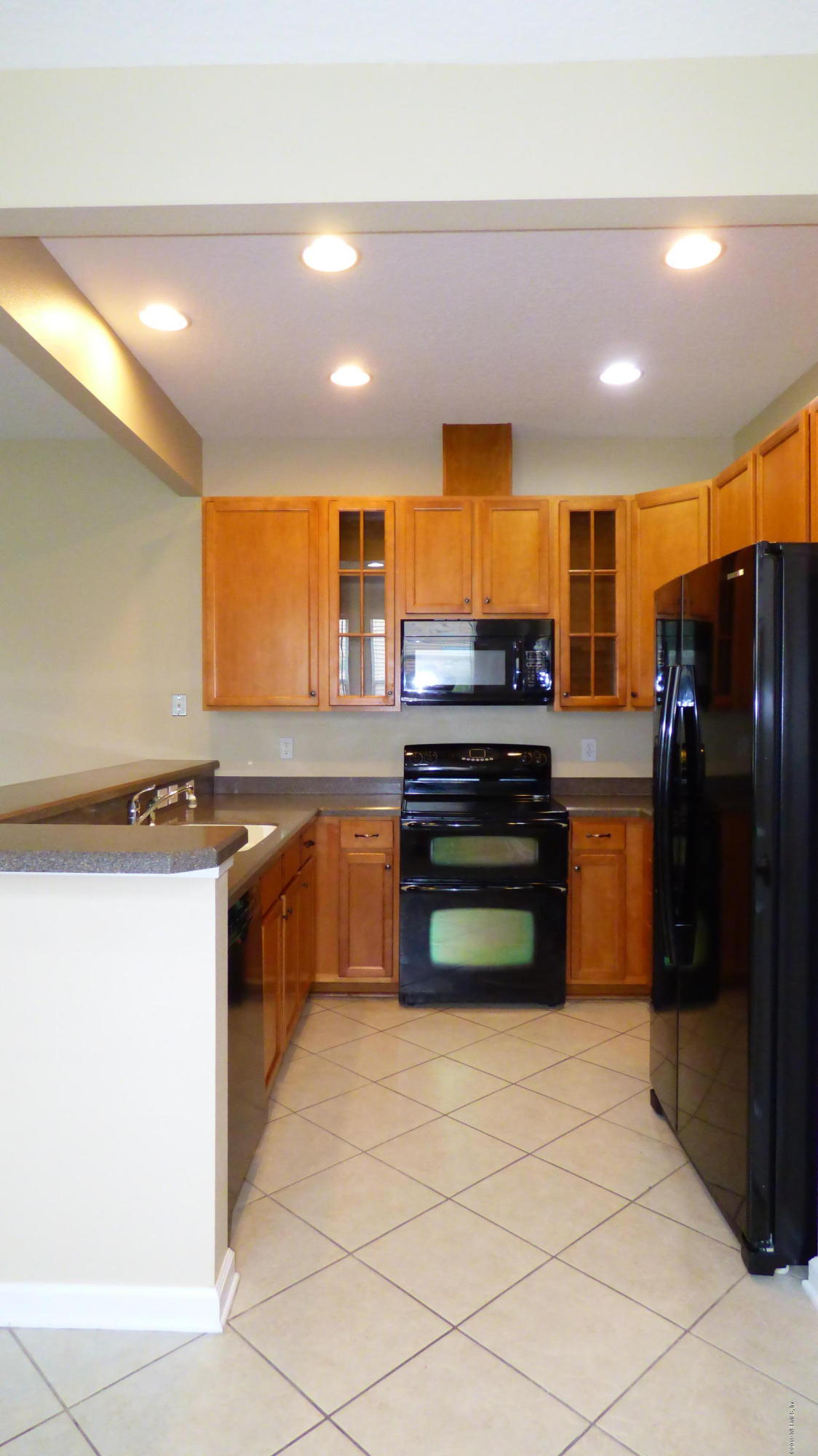 12989 Spring Rain Road Jacksonville, FL 32258 - Photo 3 of 20 a kitchen with stainless steel appliances kitchen island granite countertop a refrigerator and a stove