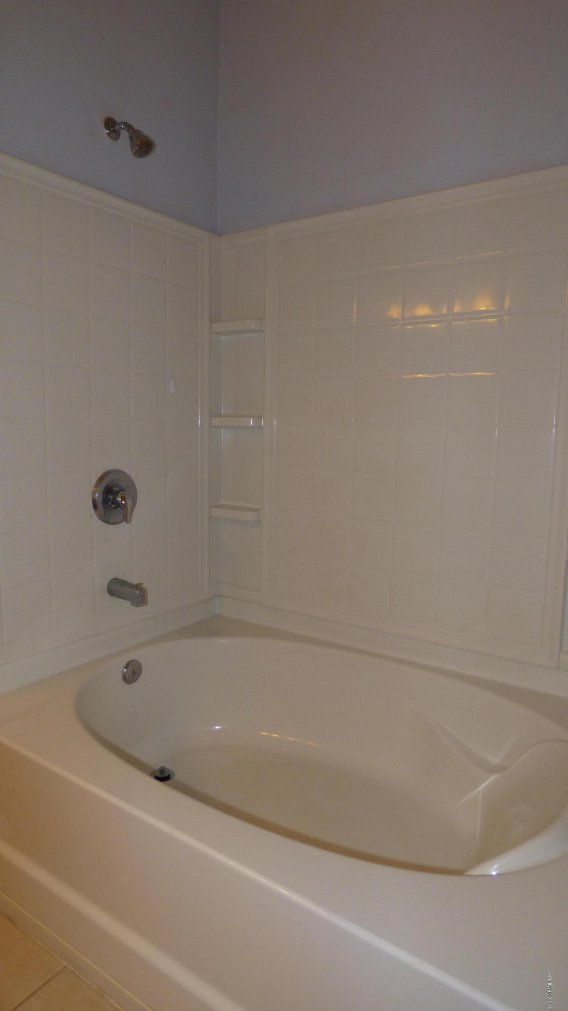 12989 Spring Rain Road Jacksonville, FL 32258 - Photo 9 of 20 a bathroom with a bathtub