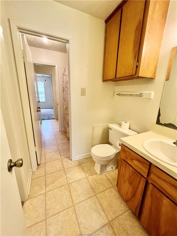 713 Vassar Court, Unit C College Station, TX 77840 - Photo 18 of 22 a bathroom with a sink and a mirror