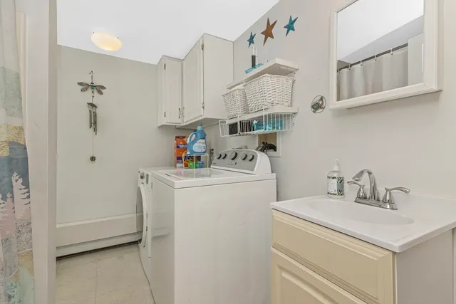 a bedroom with furniture and a wooden floor