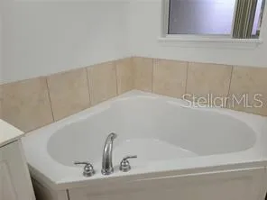 a close view of a bathtub in a bathroom