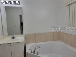 a white bath tub sitting in a bathroom