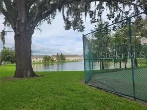 a view of lake with a yard