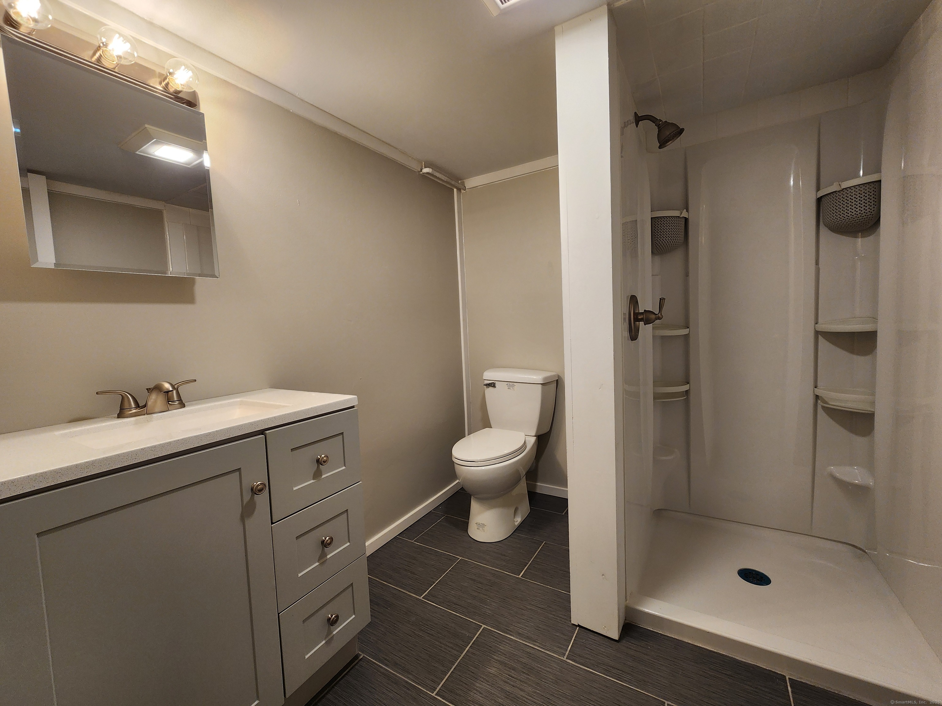 40 Durant Avenue, Unit B Bethel, CT 06801 - Photo 11 of 12 a bathroom with a toilet sink and shower