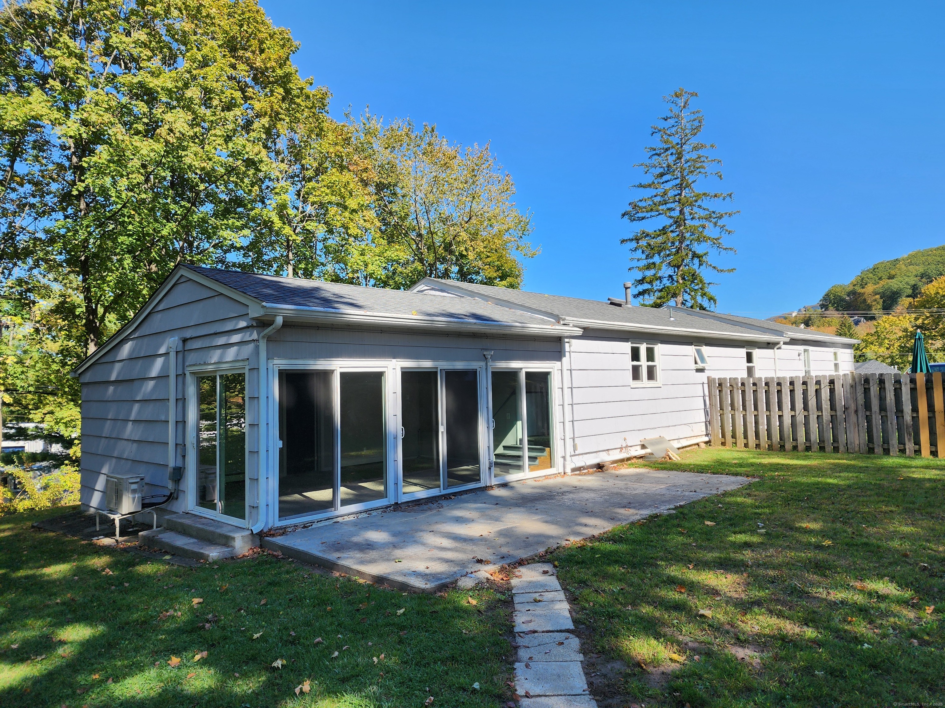 40 Durant Avenue, Unit B Bethel, CT 06801 - Photo 12 of 12 a view of a house with a yard and potted plants