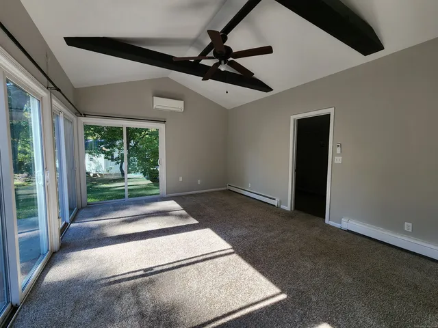 a view of a hallway with a large window