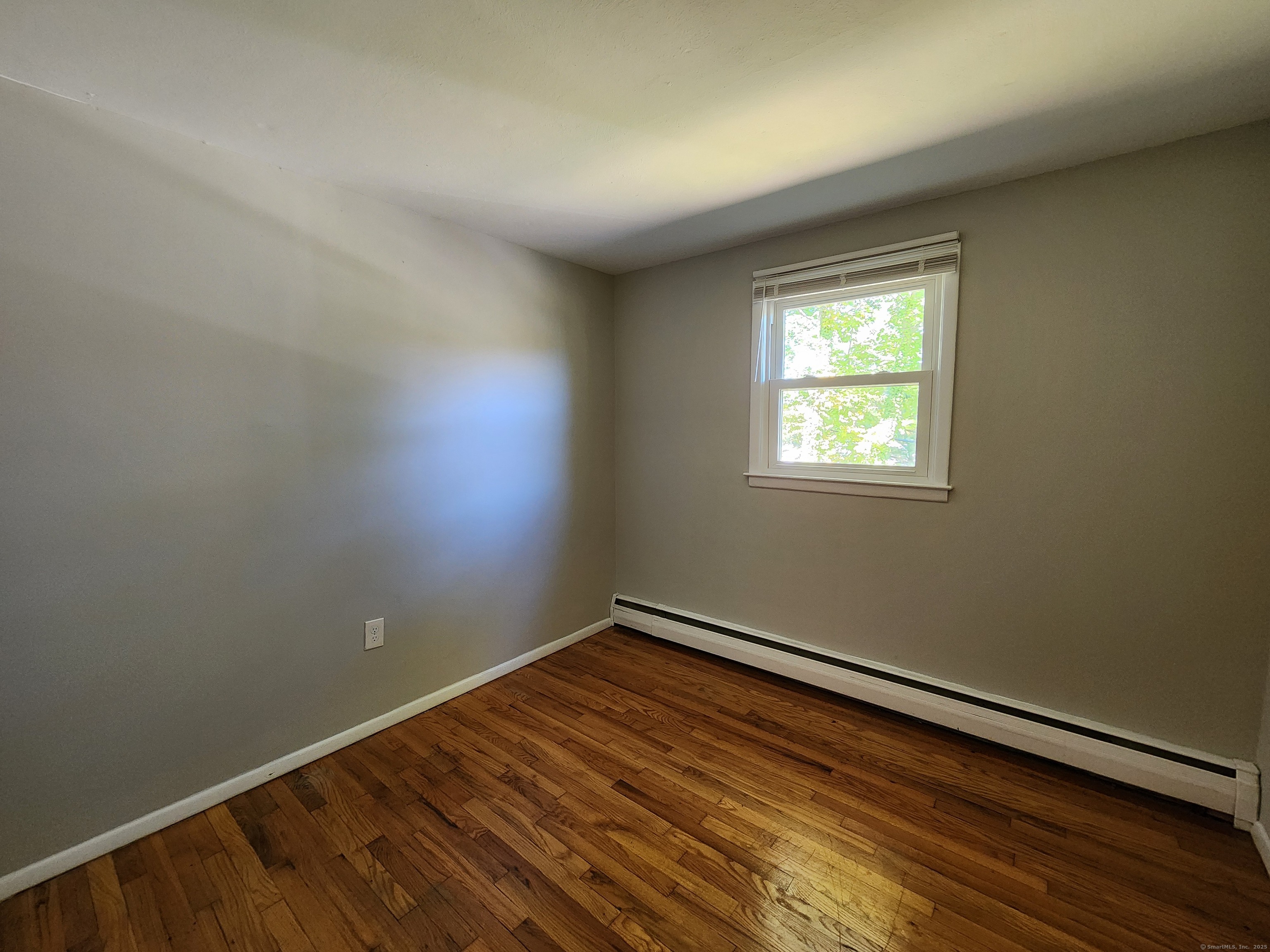 40 Durant Avenue, Unit B Bethel, CT 06801 - Photo 10 of 12 an empty room with a window