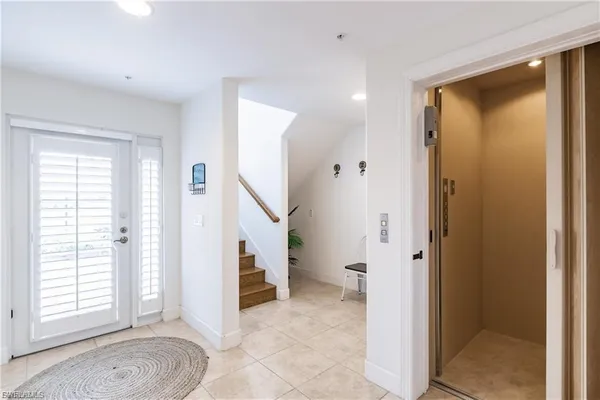 a view of entryway with white walls and windows