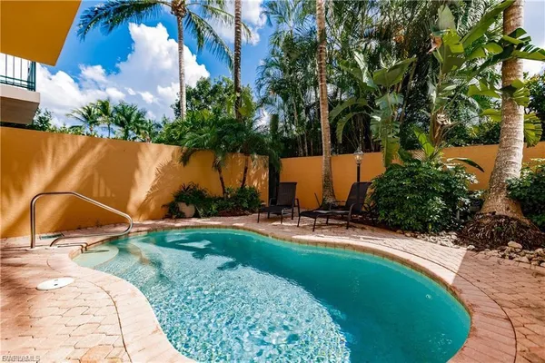 a view of a swimming pool with a backyard