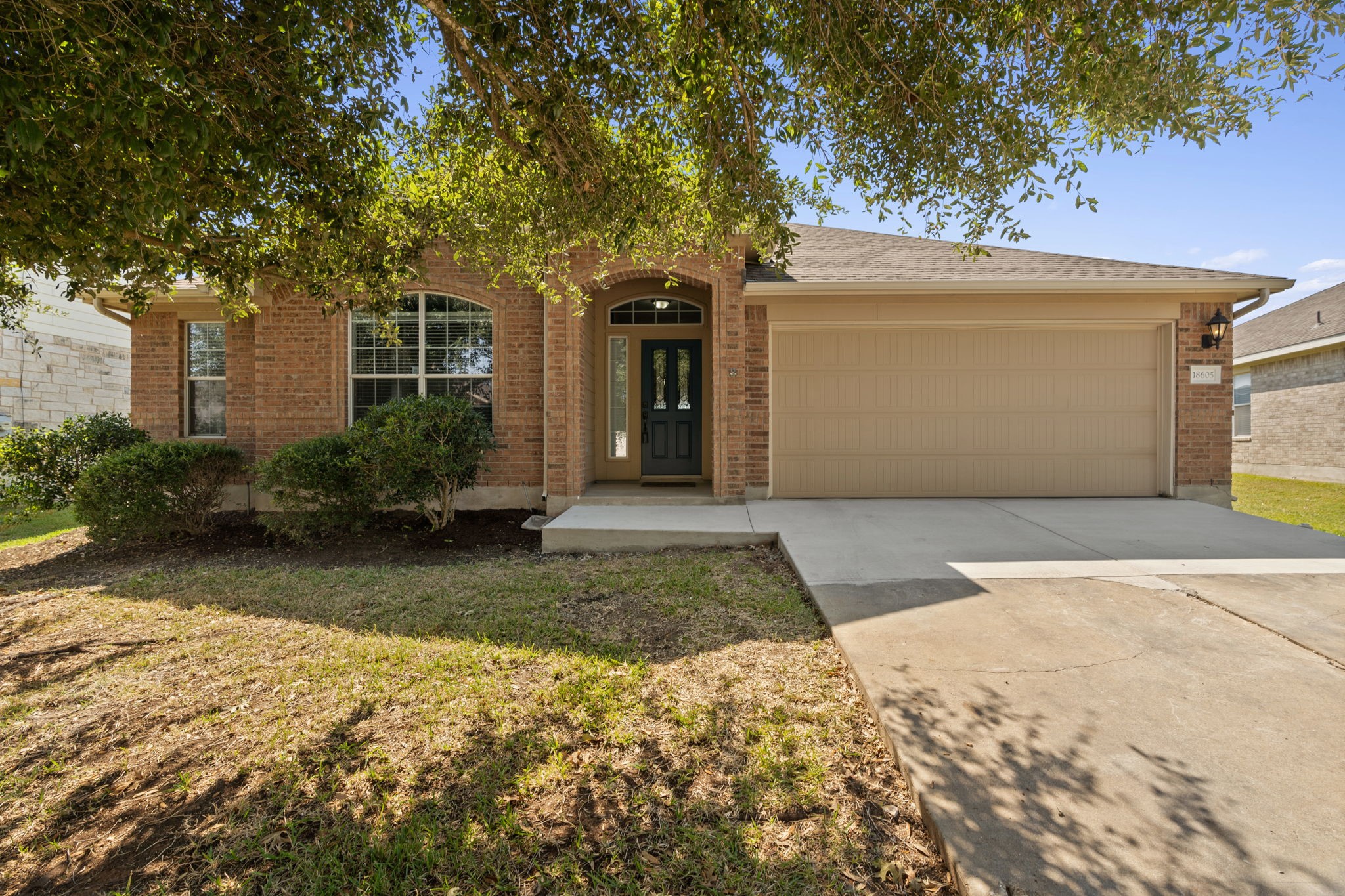 18605 Dry Brook Loop Pflugerville, TX 78660 - Photo 1 of 1 a front view of a house with garden
