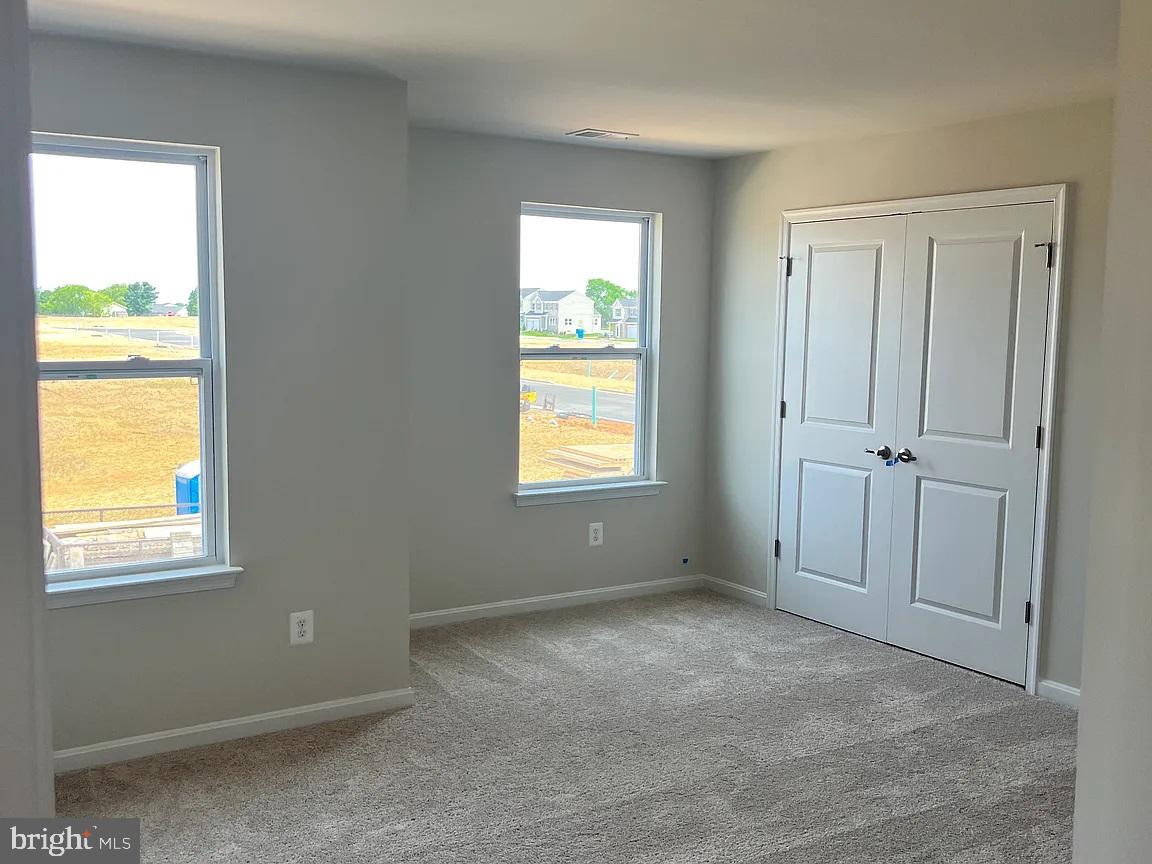 406 Freeman Street Ranson, WV 25438 - Photo 5 of 6 a view of an empty room with a window