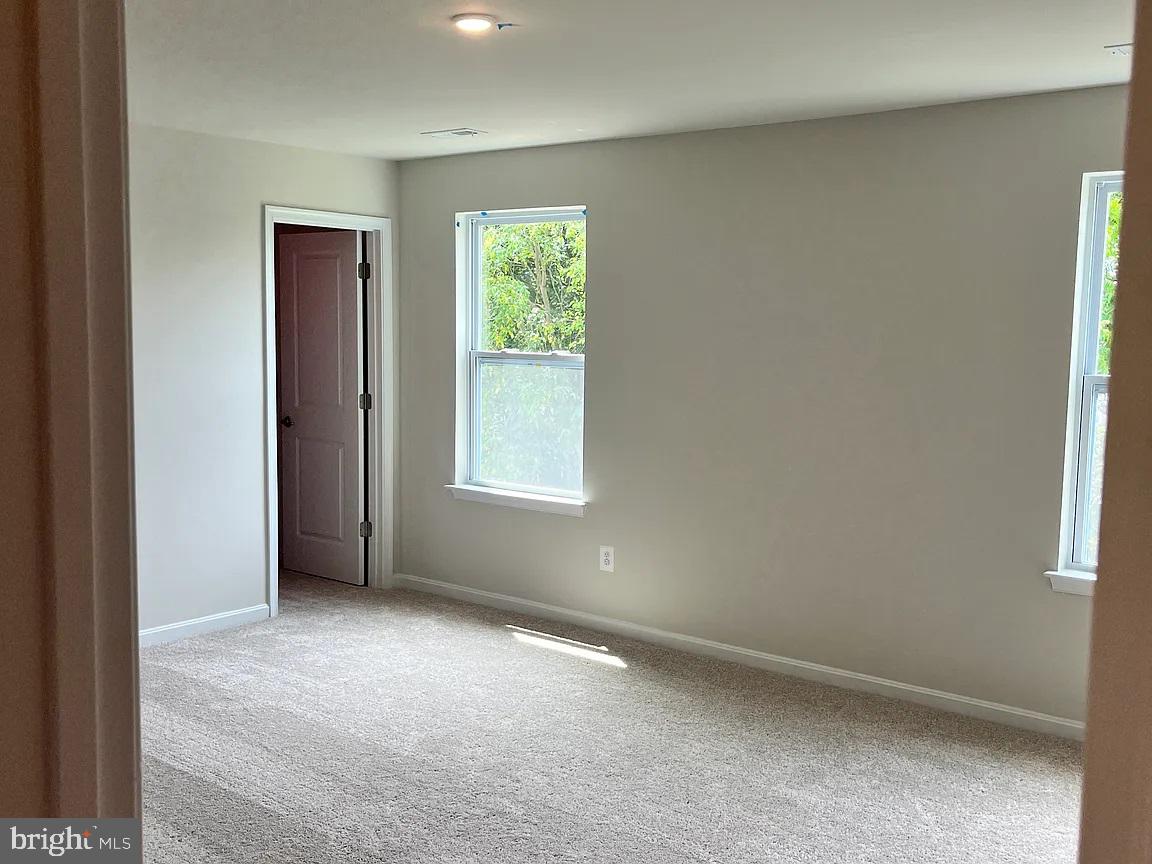 406 Freeman Street Ranson, WV 25438 - Photo 6 of 6 an empty room with windows