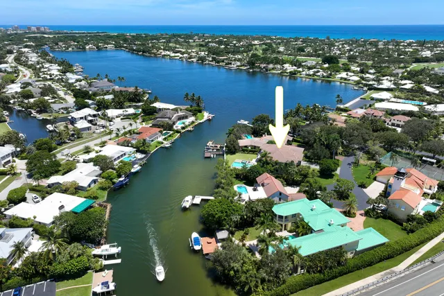 an aerial view of lake houses residential house with outdoor space and swimming pool