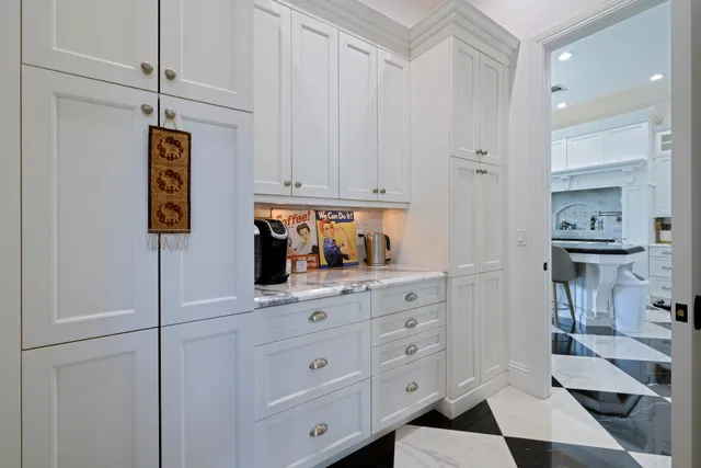 a bedroom with furniture and a flat screen tv