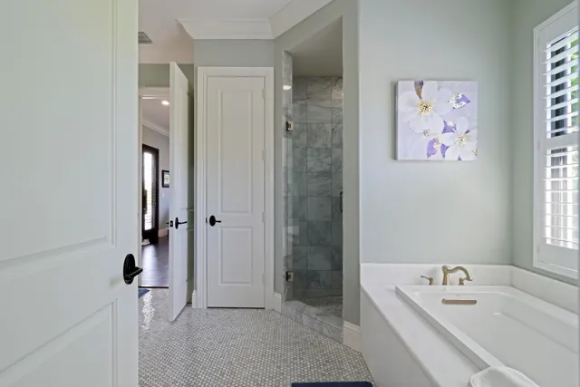 a bathroom with a granite countertop sink a toilet a mirror and shower