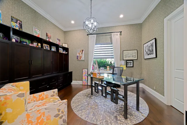 a view of a hallway with wooden floor and stairs