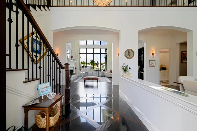 a view of an entryway and wooden floor