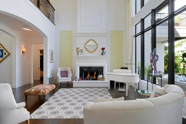 a living room with furniture a window and a fireplace