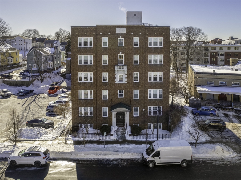 50 Broadway, Unit 27 Beverly, MA 01915 - Photo 1 of 10 a front view of a building with parking space