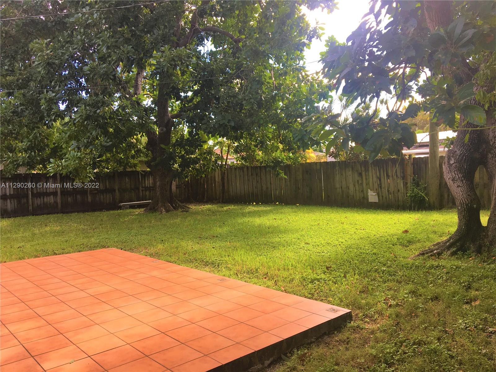 6442 Southwest 37th Street Miami, FL 33155 - Photo 11 of 14 a view of a backyard with large trees