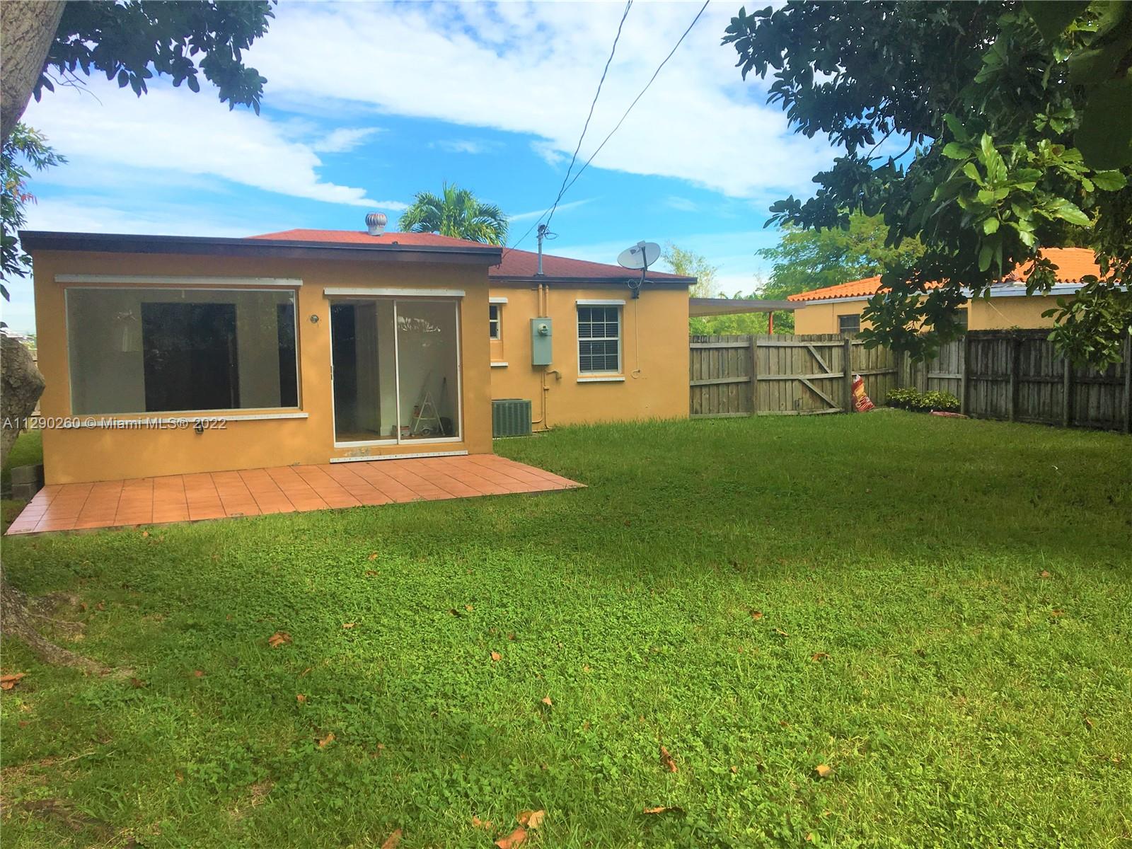 6442 Southwest 37th Street Miami, FL 33155 - Photo 12 of 14 a view of a house with a yard
