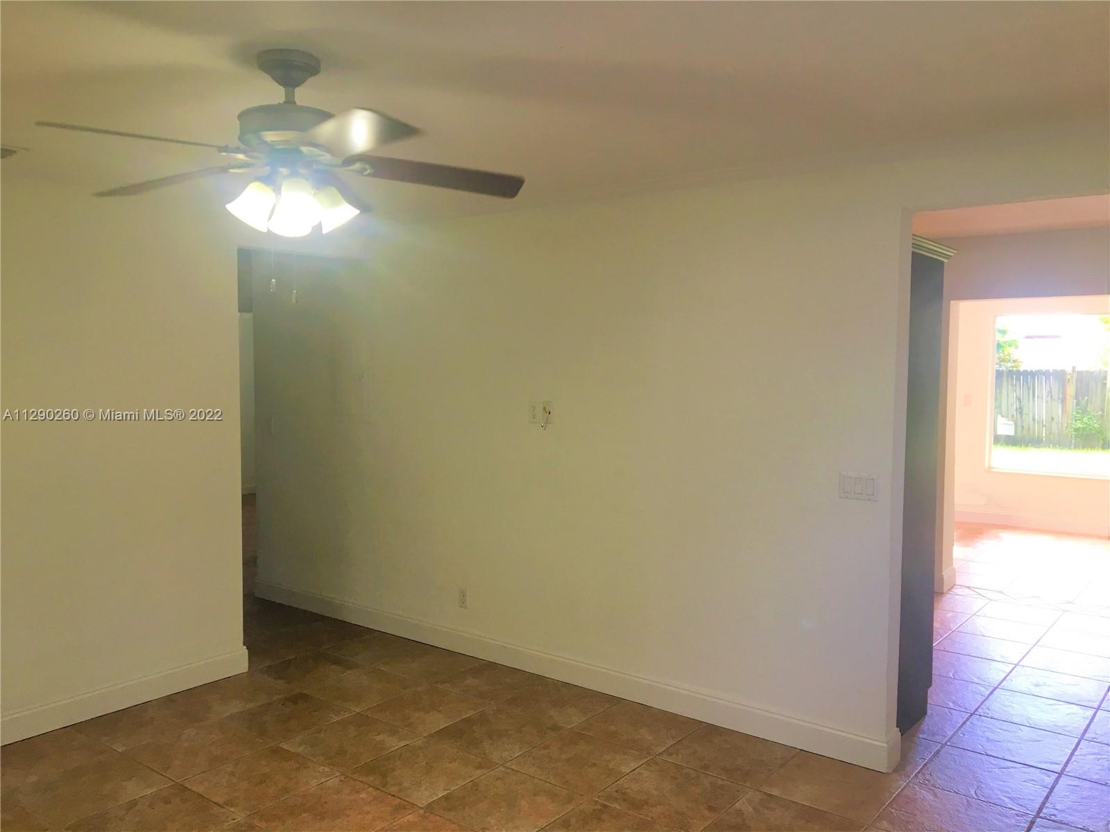 6442 Southwest 37th Street Miami, FL 33155 - Photo 4 of 14 a view of an empty room and window