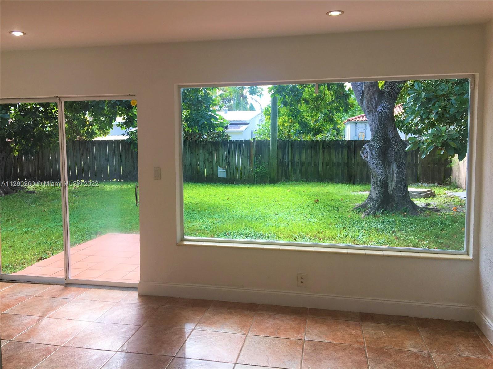6442 Southwest 37th Street Miami, FL 33155 - Photo 5 of 14 a view of a porch with a backyard