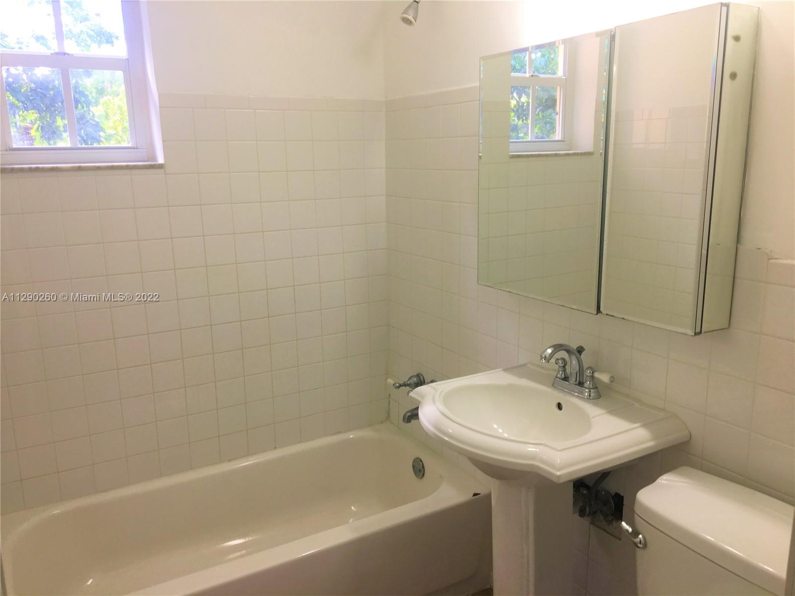 6442 Southwest 37th Street Miami, FL 33155 - Photo 7 of 14 a bathroom with a sink a toilet and shower