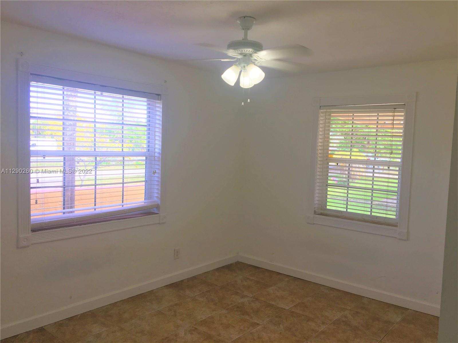 6442 Southwest 37th Street Miami, FL 33155 - Photo 8 of 14 a view of an empty room with a window