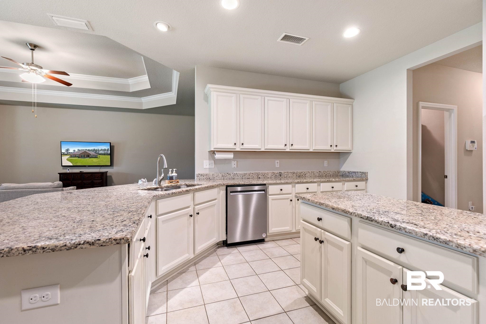 12750 B Jenkins Pit Road Daphne, AL 36527 - Photo 24 of 89 Kitchen with a ceiling fan, crown molding, light stone counters, white cabinetry, and dishwasher