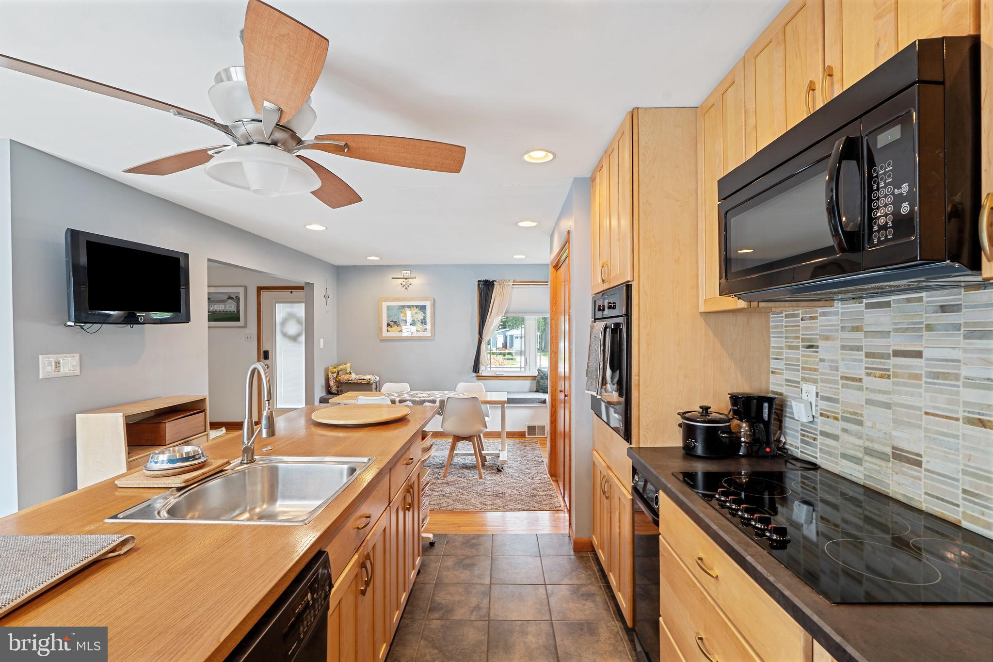 602 Rancocas Avenue Riverside, NJ 08075 - Photo 11 of 40 a kitchen with stainless steel appliances granite countertop a sink a stove top oven a granite counter space and cabinets