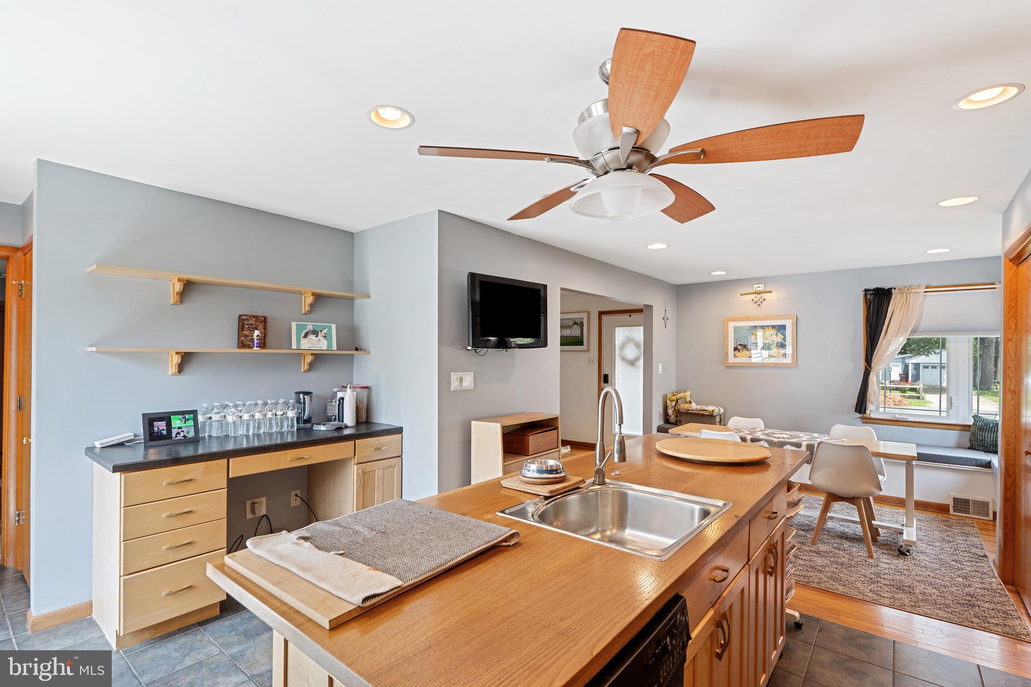 602 Rancocas Avenue Riverside, NJ 08075 - Photo 12 of 40 a living room with stainless steel appliances furniture a rug and a flat screen tv