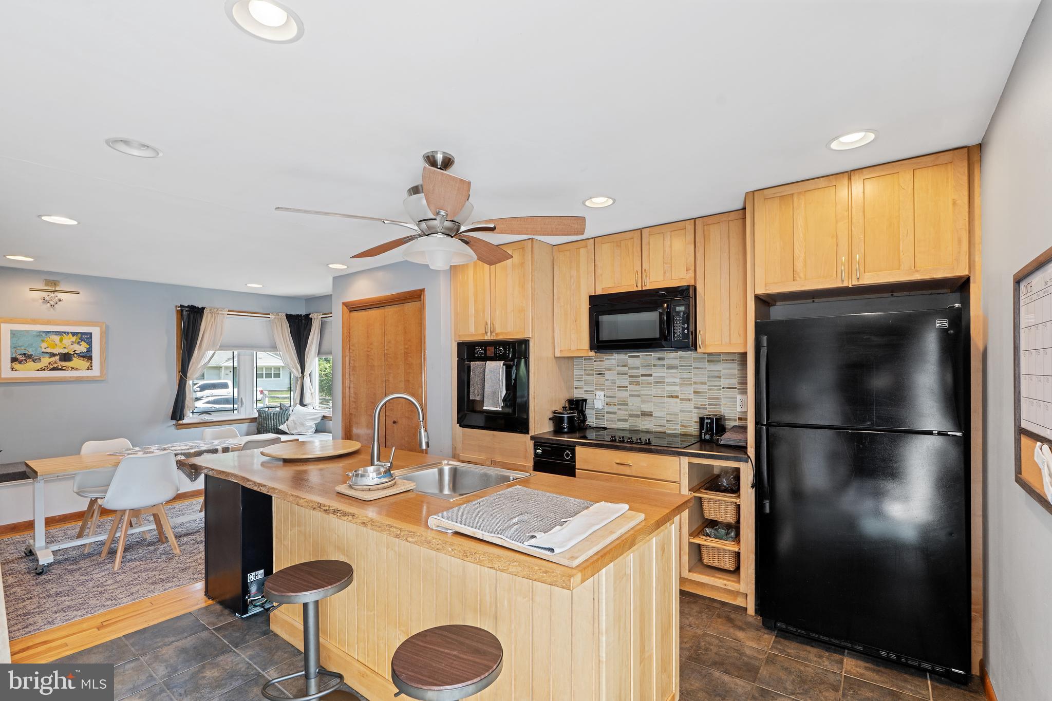 602 Rancocas Avenue Riverside, NJ 08075 - Photo 13 of 40 a kitchen with kitchen island granite countertop a sink appliances cabinets and furniture