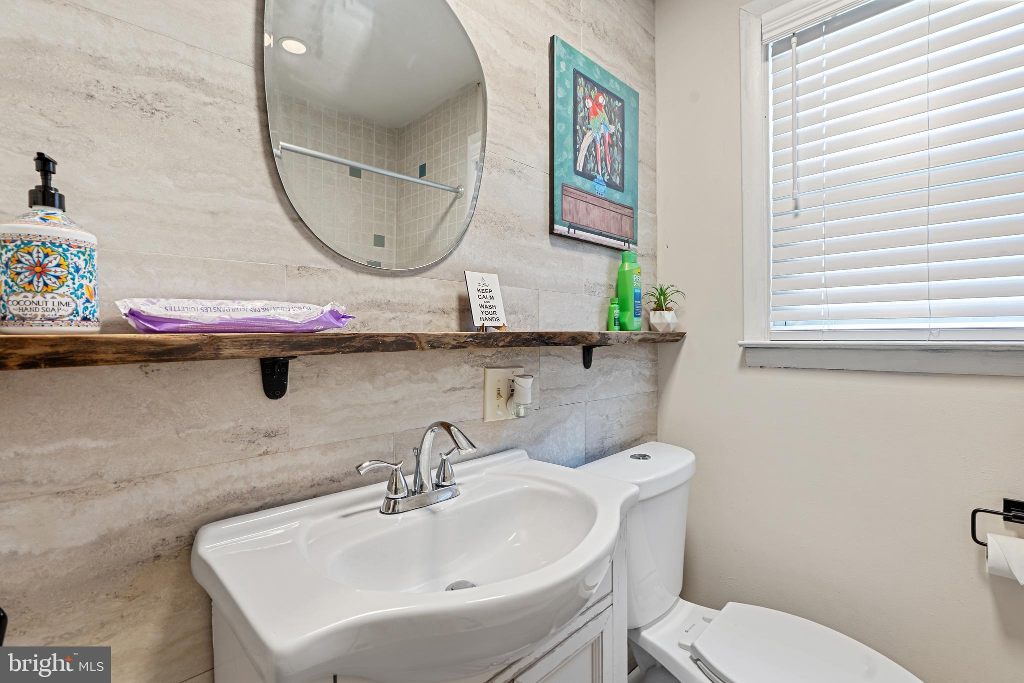 602 Rancocas Avenue Riverside, NJ 08075 - Photo 17 of 40 a bathroom with a toilet sink and mirror