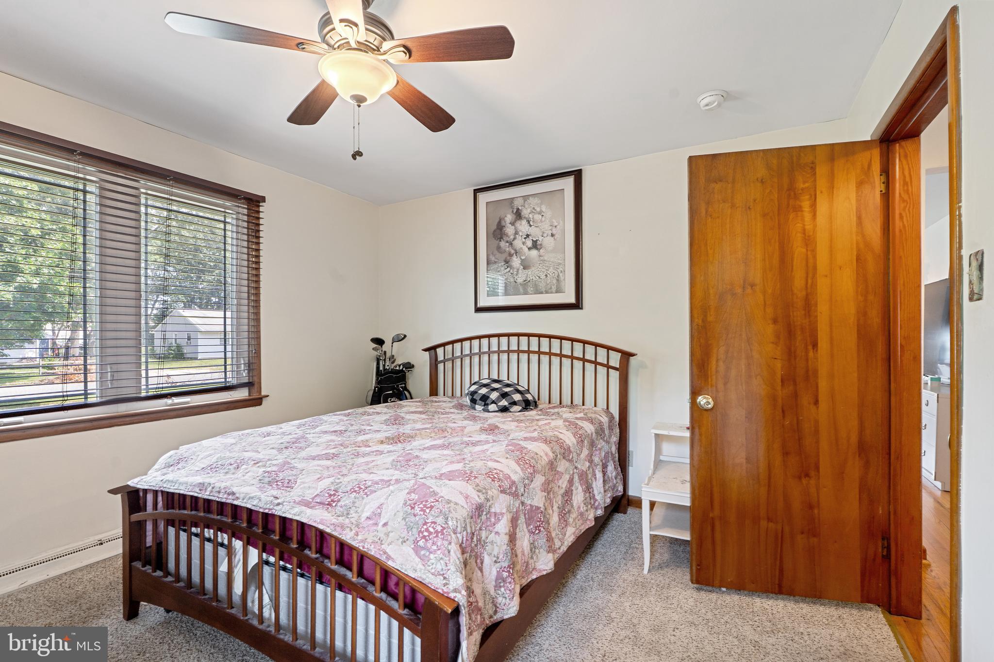602 Rancocas Avenue Riverside, NJ 08075 - Photo 19 of 40 a bedroom with a bed and a chandelier