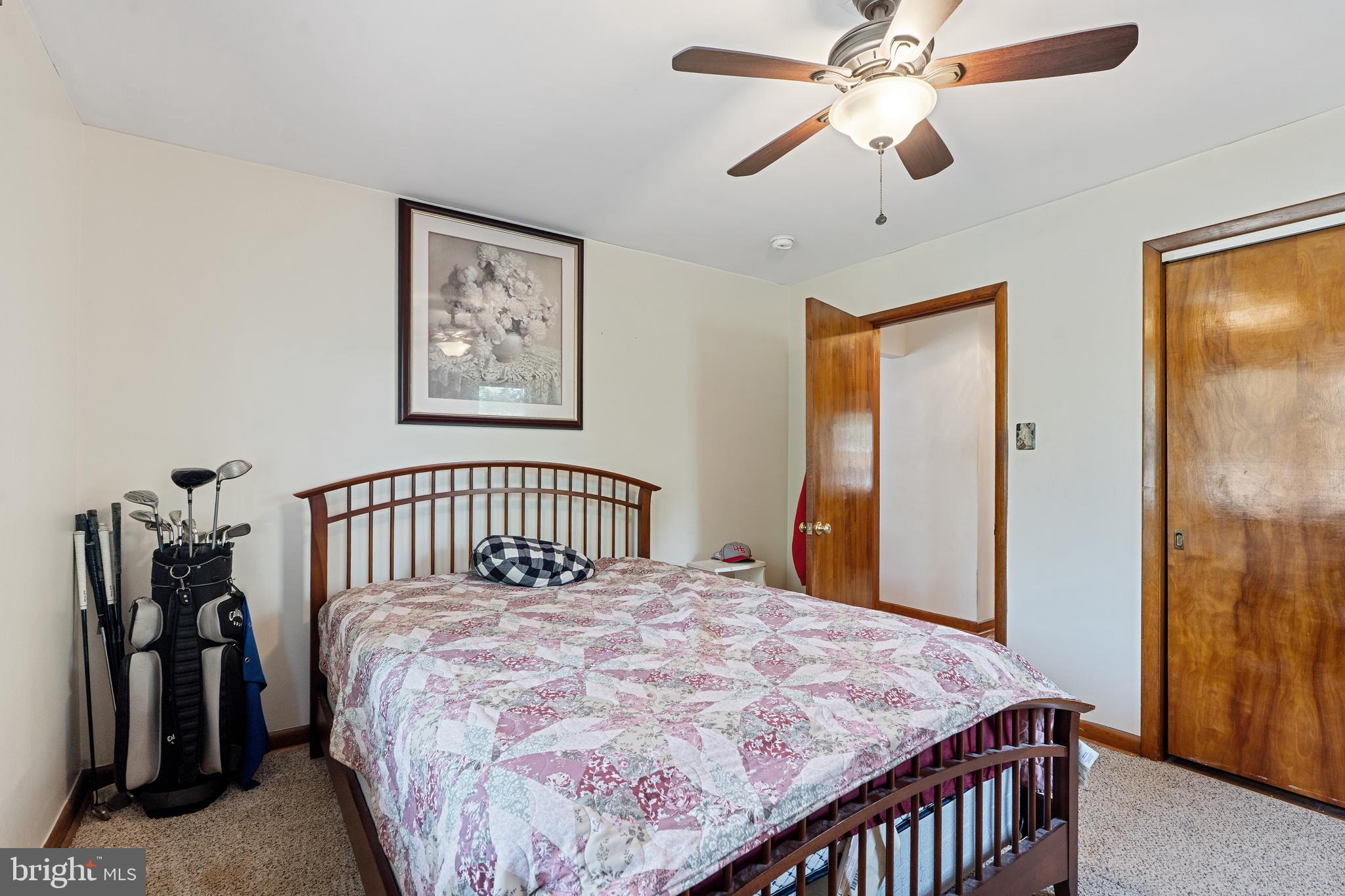 602 Rancocas Avenue Riverside, NJ 08075 - Photo 20 of 40 a bedroom with a bed and a chandelier