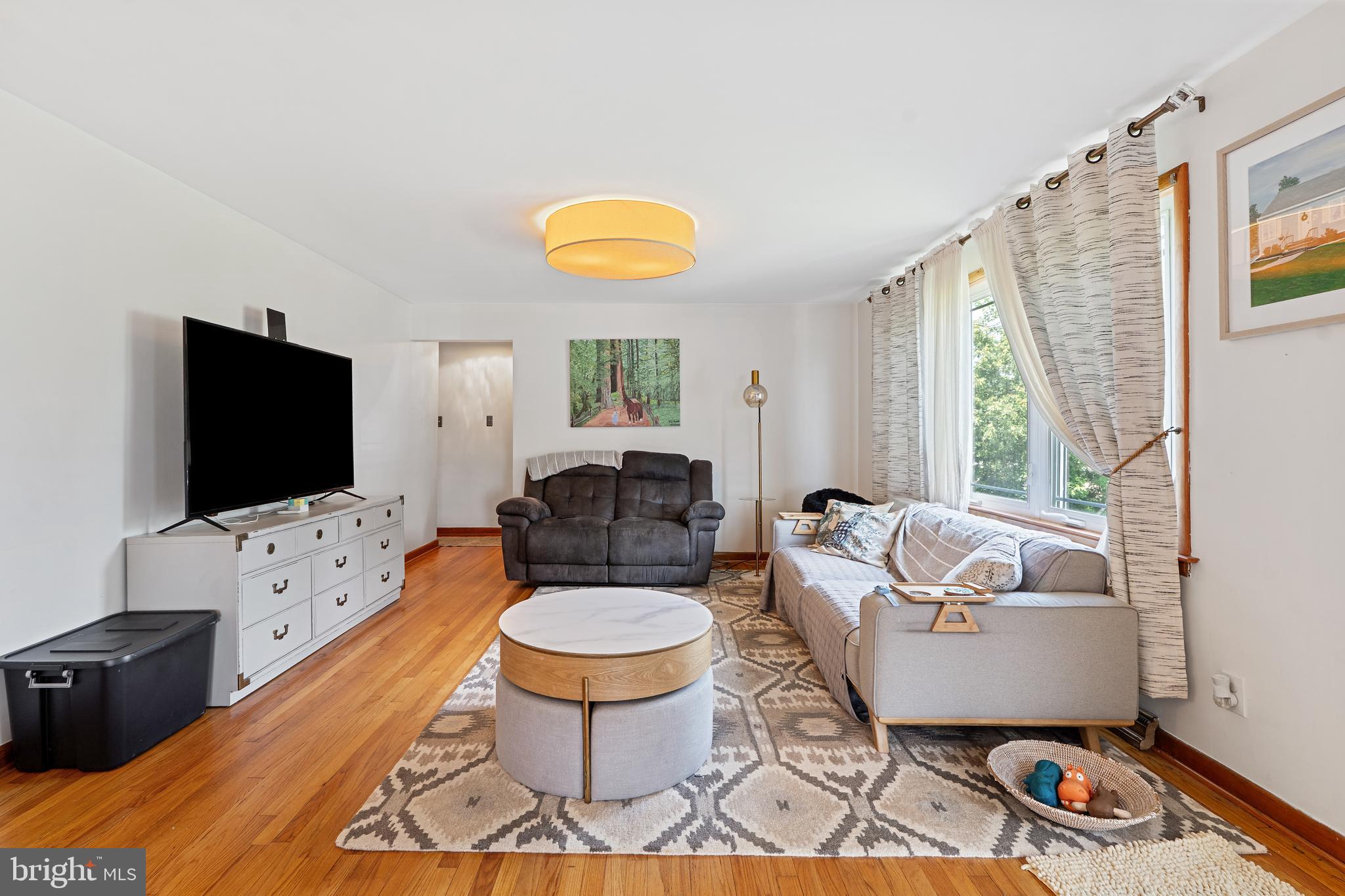 602 Rancocas Avenue Riverside, NJ 08075 - Photo 2 of 40 a living room with furniture a flat screen tv and a window