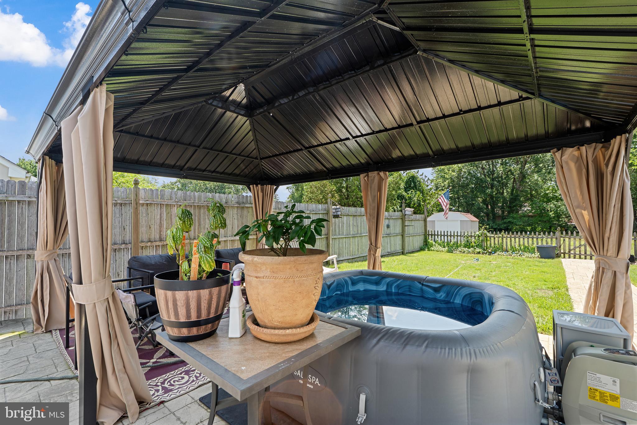 602 Rancocas Avenue Riverside, NJ 08075 - Photo 27 of 40 a view of a patio with table and chairs potted plants with floor to ceiling window