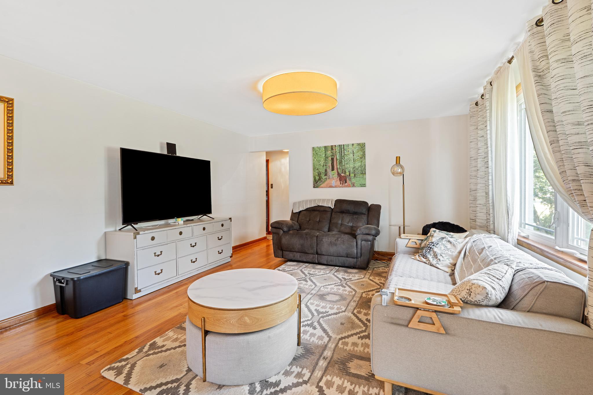 602 Rancocas Avenue Riverside, NJ 08075 - Photo 5 of 40 a living room with furniture and a flat screen tv