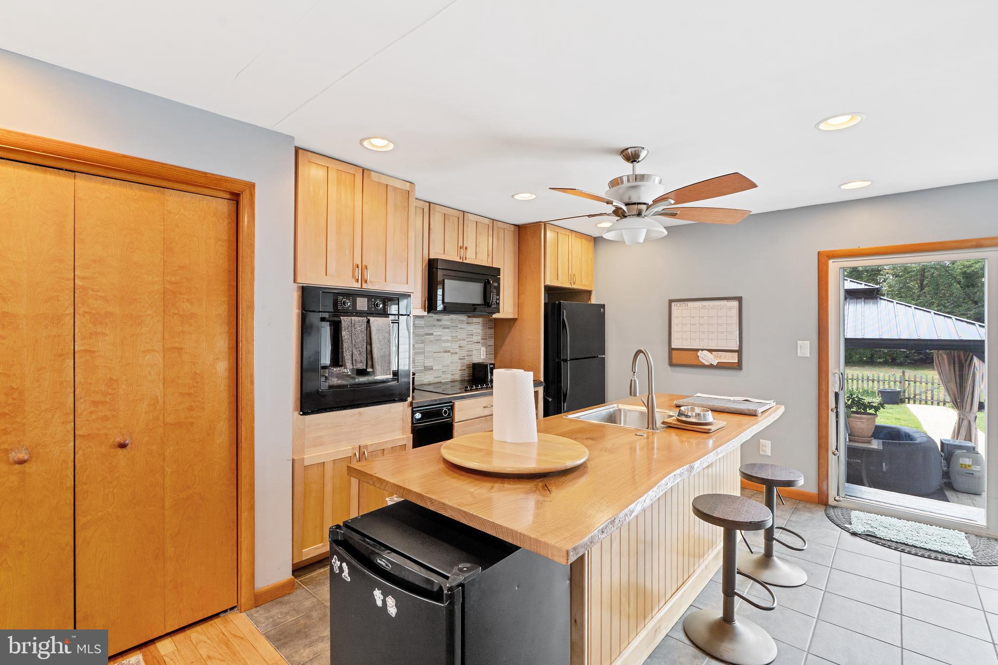 602 Rancocas Avenue Riverside, NJ 08075 - Photo 8 of 40 a kitchen with stainless steel appliances a table and chairs