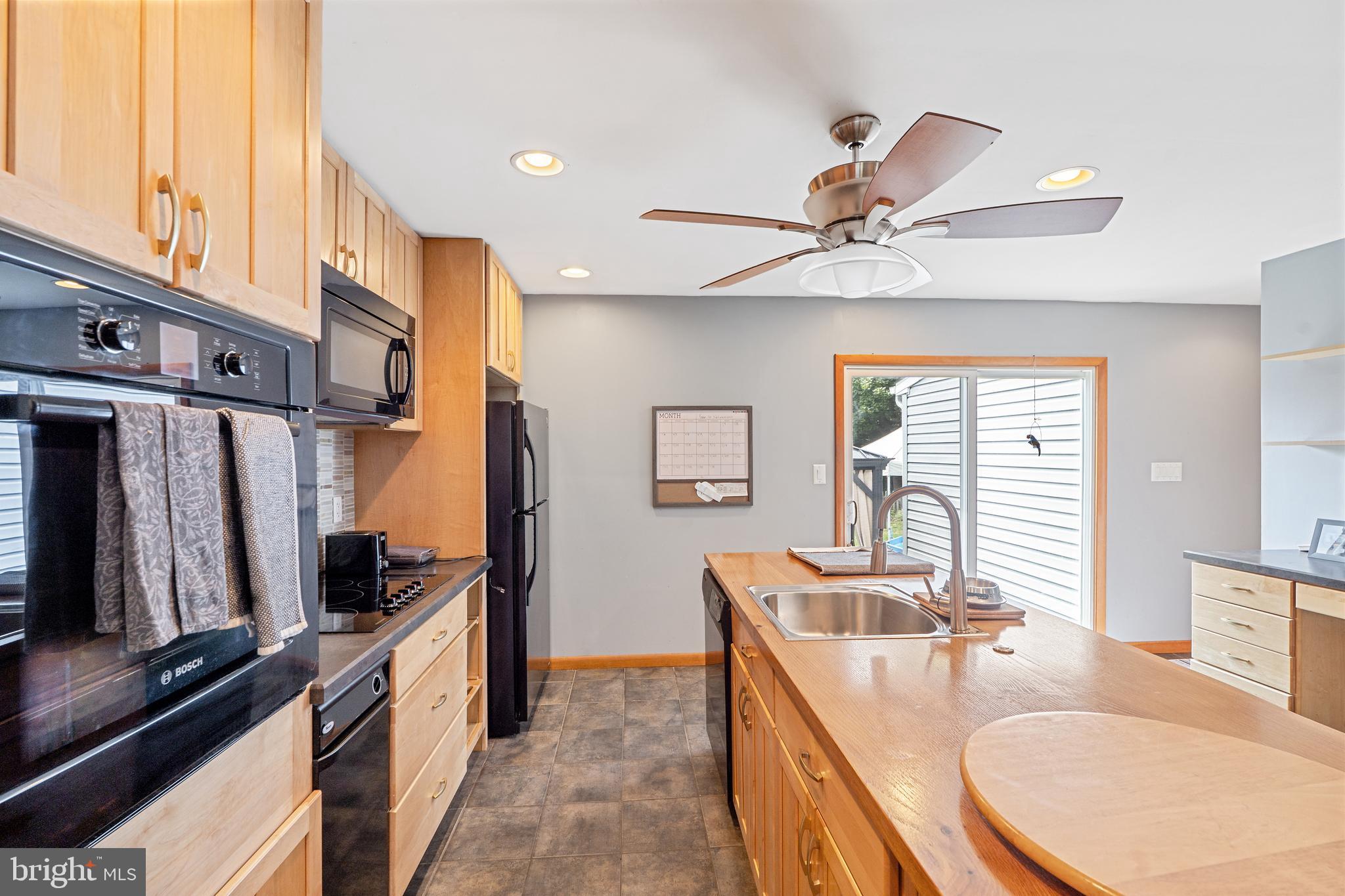 602 Rancocas Avenue Riverside, NJ 08075 - Photo 10 of 40 a kitchen with stainless steel appliances granite countertop a sink refrigerator and cabinets