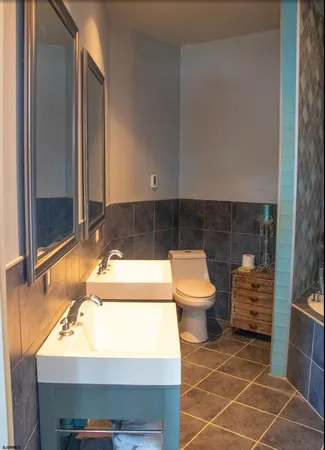 a bathroom with a sink and a shower
