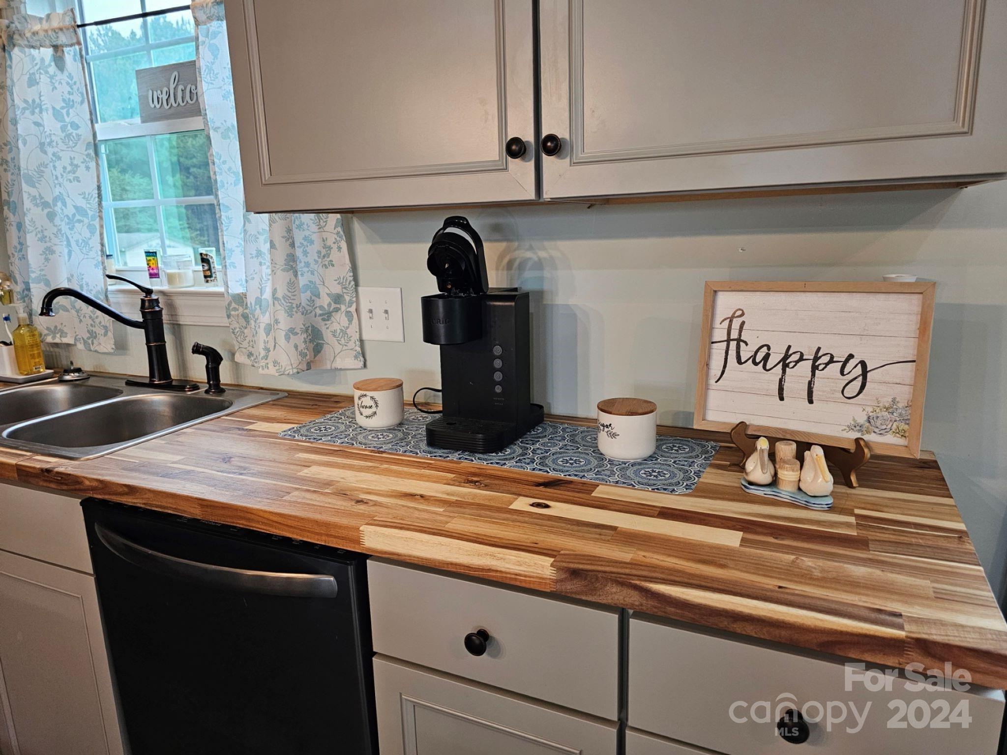 302 Flint Hill Road Cherryville, NC 28021 - Photo 12 of 32 a kitchen with a sink and a stove
