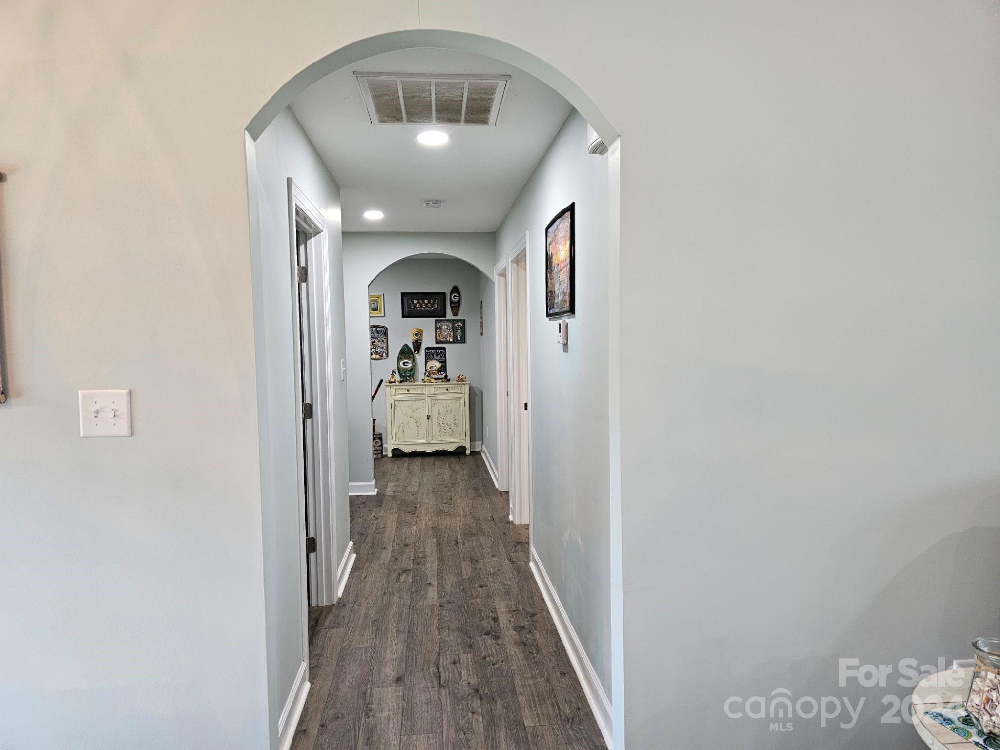 302 Flint Hill Road Cherryville, NC 28021 - Photo 15 of 32 a view of a hallway with wooden floor and a livingroom