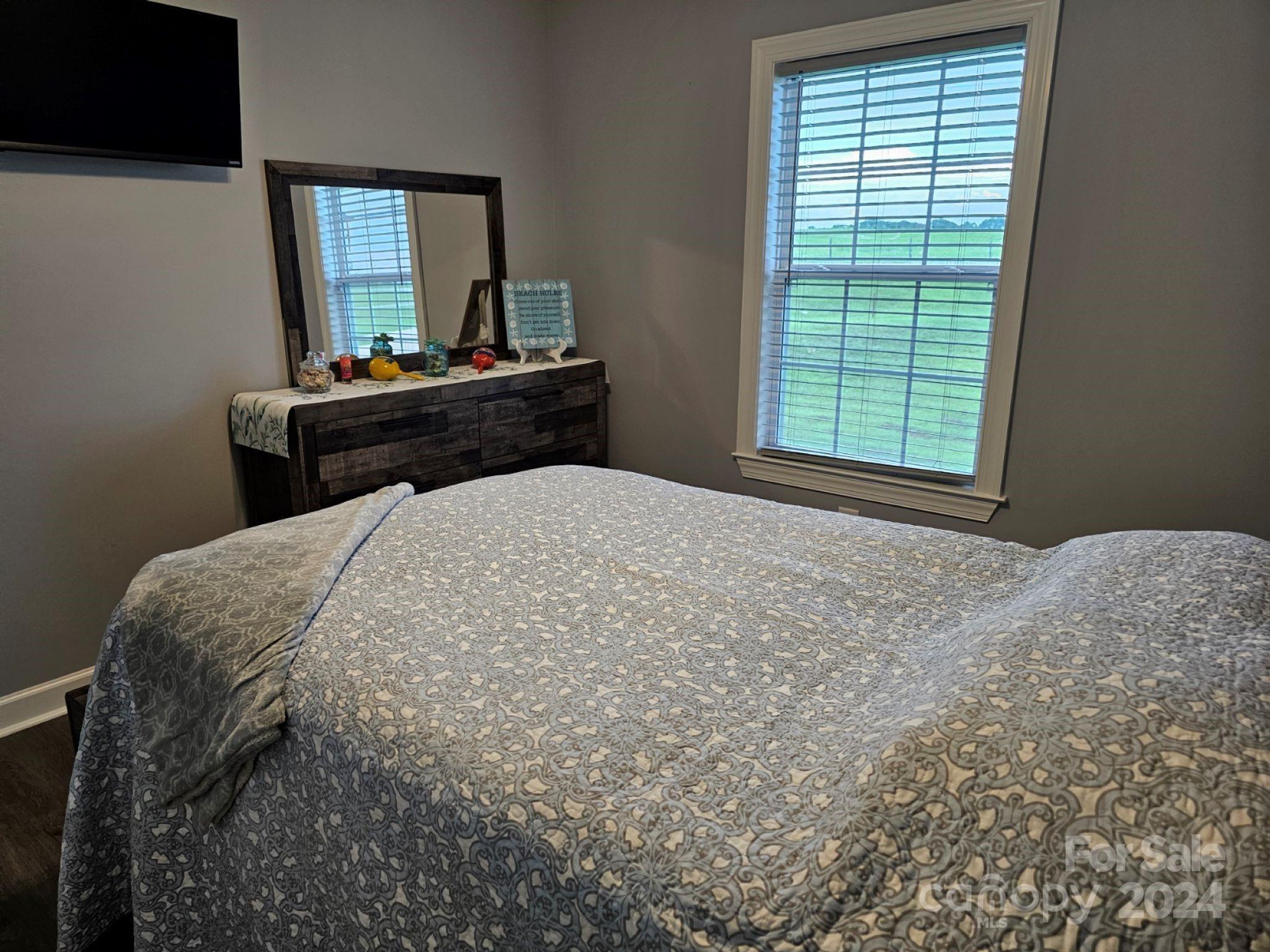 302 Flint Hill Road Cherryville, NC 28021 - Photo 18 of 32 a bedroom with a bed and a window