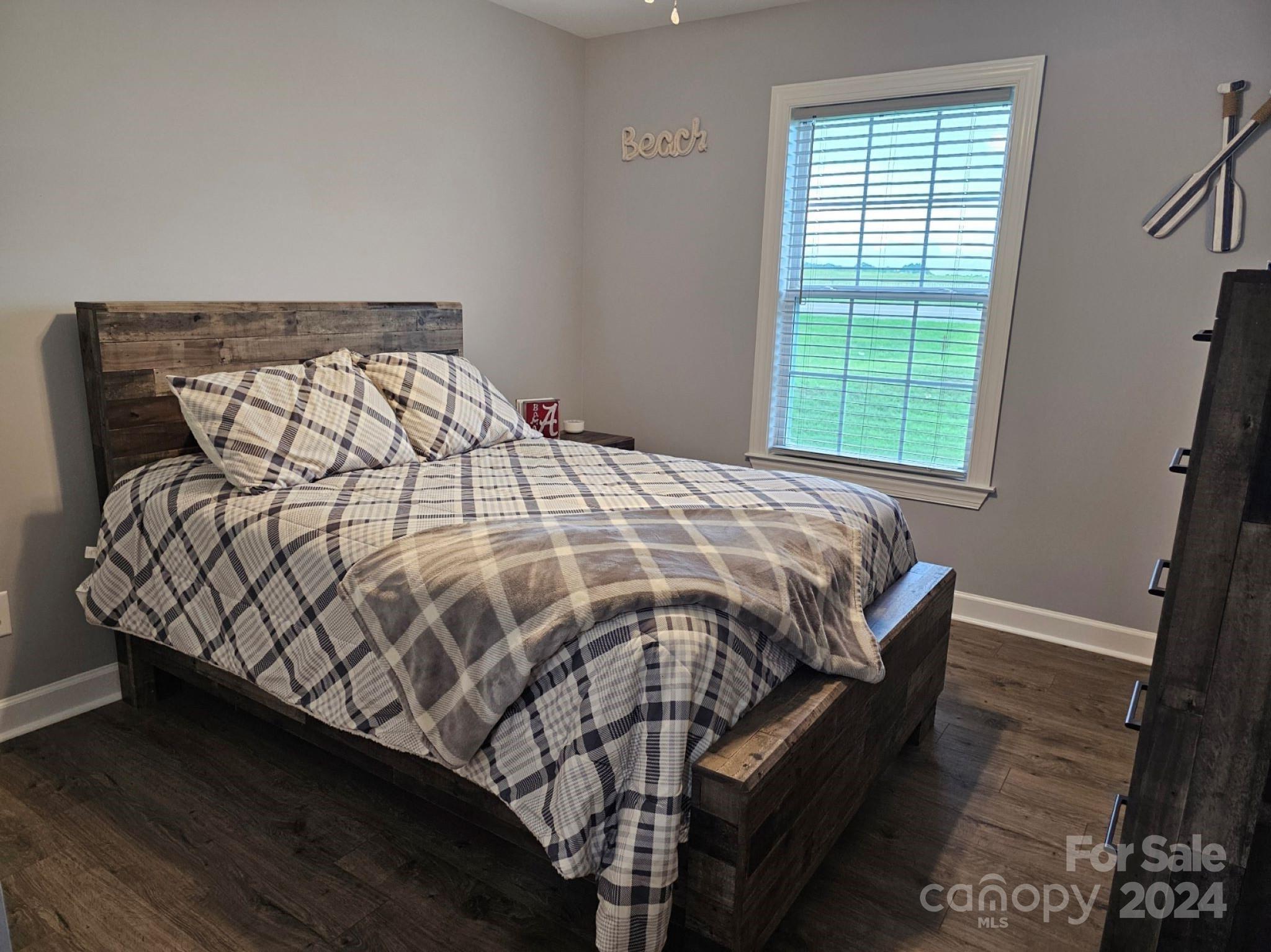 302 Flint Hill Road Cherryville, NC 28021 - Photo 20 of 32 a bed sitting in a bedroom next to a window