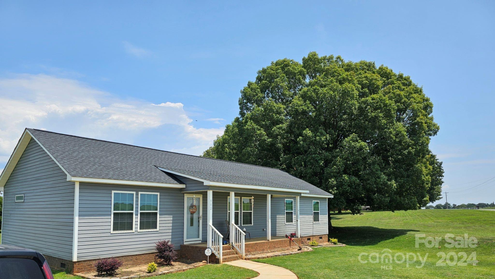 302 Flint Hill Road Cherryville, NC 28021 - Photo 2 of 32 a view of a house with a yard