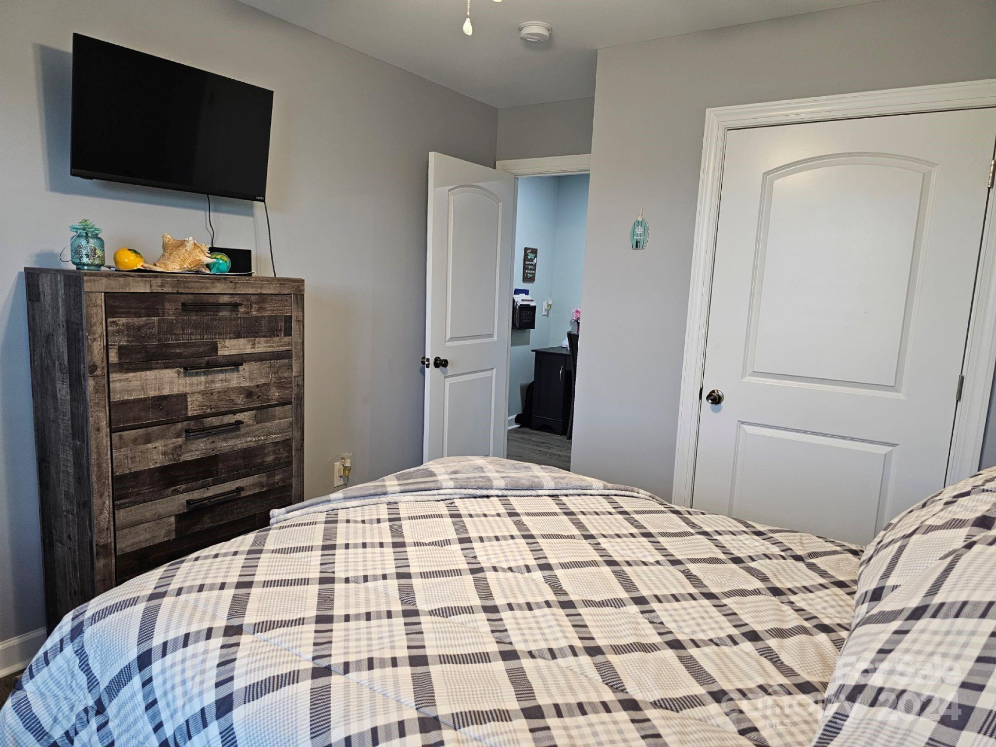 302 Flint Hill Road Cherryville, NC 28021 - Photo 21 of 32 a bedroom with a bed and a flat screen tv