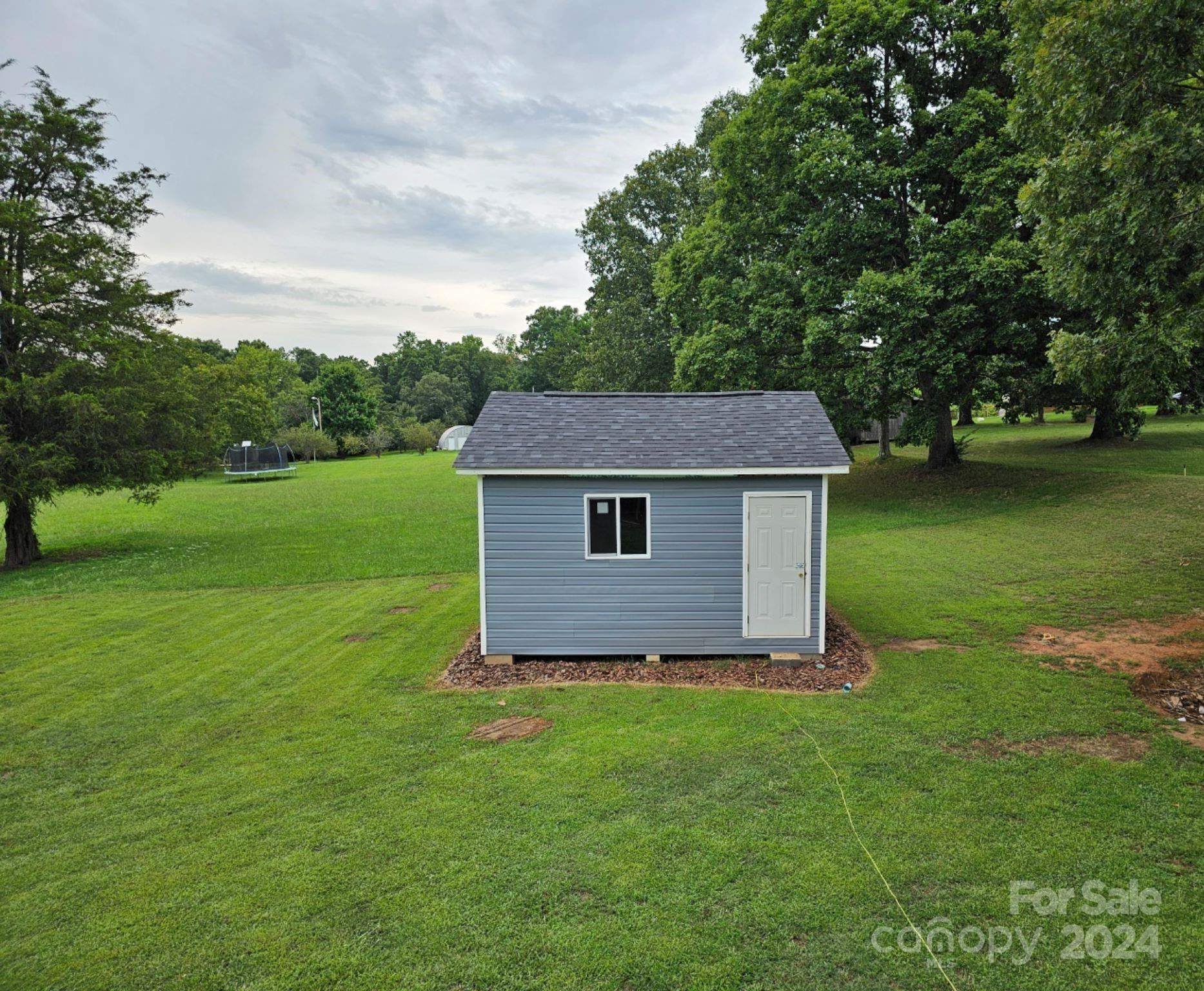 302 Flint Hill Road Cherryville, NC 28021 - Photo 31 of 32 a view of a backyard of the house