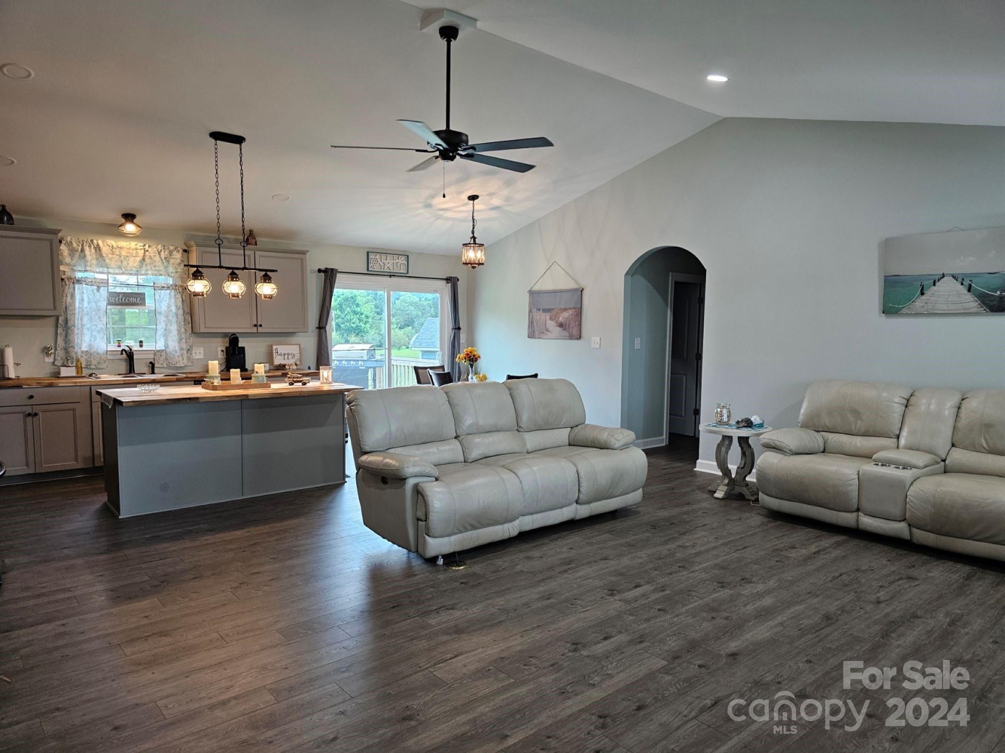 302 Flint Hill Road Cherryville, NC 28021 - Photo 5 of 32 a living room with furniture and kitchen chandelier